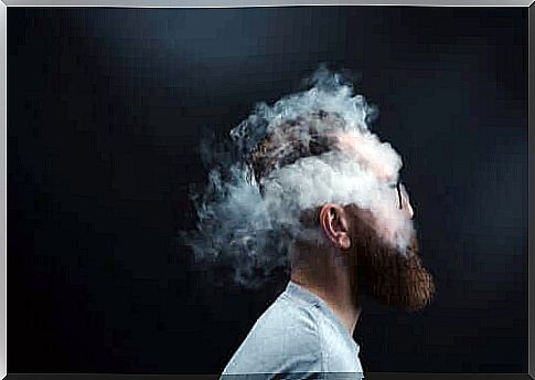 A man's head surrounded by smoke